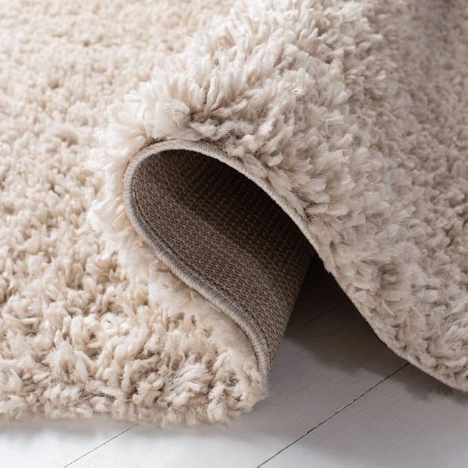 SAFAVIEH August Shag Collection Area Rug - 6'7" x 9', Beige, Solid Design, Non-Shedding & Easy Care, 1.5-inch Thick Ideal for High Traffic Areas in Living Room, Bedroom (AUG200D)