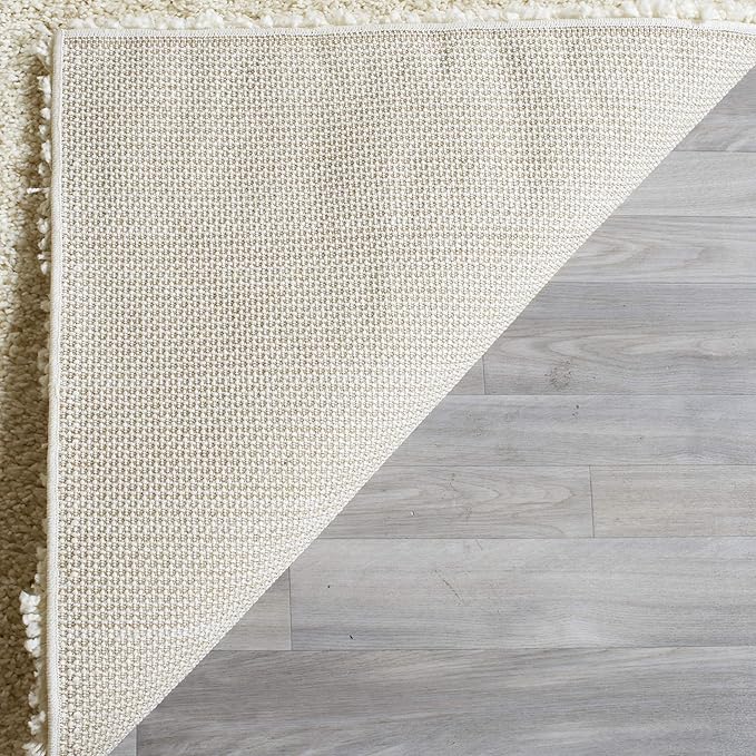 SAFAVIEH Santa Monica Shag Collection Accent Rug - 2'3" x 5', Ivory, Solid Design, 2-inch Thick Ideal for High Traffic Areas in Living Room, Bedroom, Dining (SGN725-1212-25)