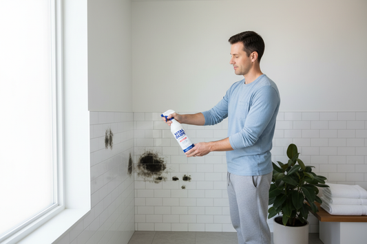 Vital Oxide EPA-registered disinfectant being sprayed on bathroom mold stains for safe home remediation
